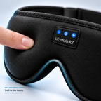 Close-up of the black sleep mask fabric and power and volume controls