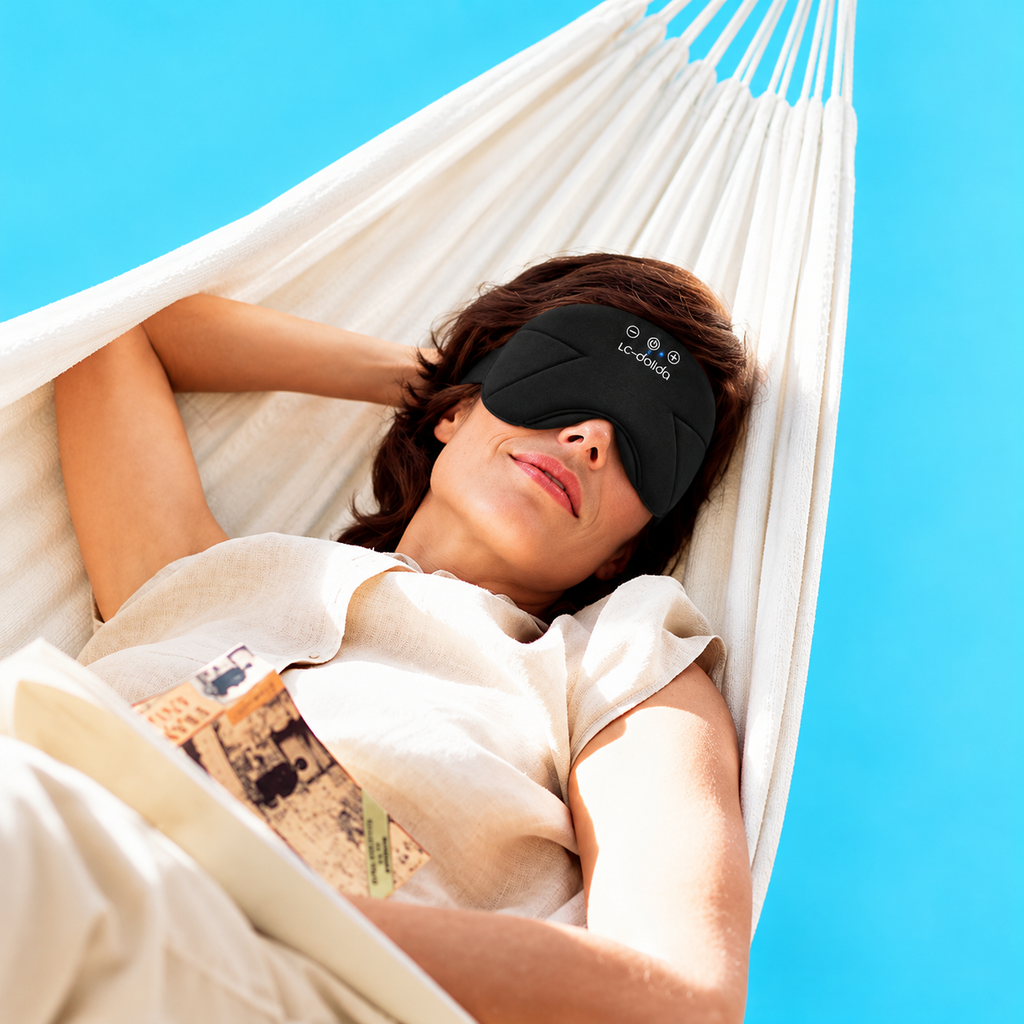 Woman resting in a hammock wearing a black cushioned sleep mask
