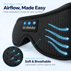 Close-up of the perforated fabric and controls on the Bluetooth sleep mask